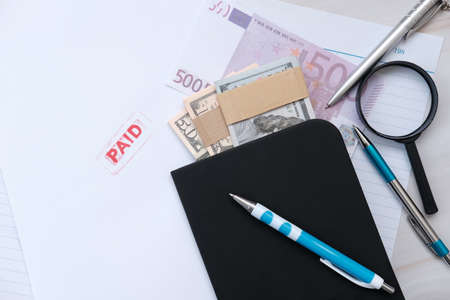 Notebook and pen on a desk in an office and office equipment concept
