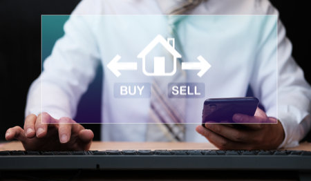 Businessman buy house, real estate concept, different offers of property online, hands typing on computer a virtual screening backgroundの写真素材