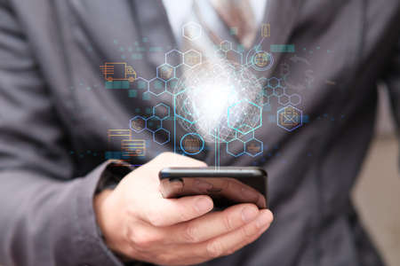 Businessman working using smartphone cargo and tracking delivery for Transportation and global network of smart logisticsの写真素材