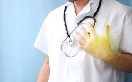 Doctor holding a stethoscope in his hand, close-up.