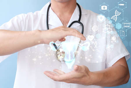 Doctor holding stethoscope and digital hologram on blue background, closeupの写真素材