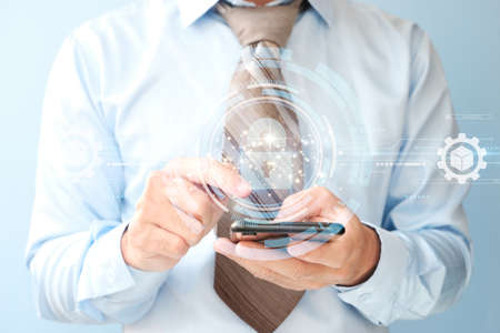 businessman hand working with smart phone and digital layer effect as concept