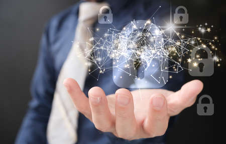 Businessman holding virtual screen with padlock and network connection, closeup