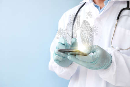Doctor in medical gloves holding mobile phone, closeup. Space for textの写真素材