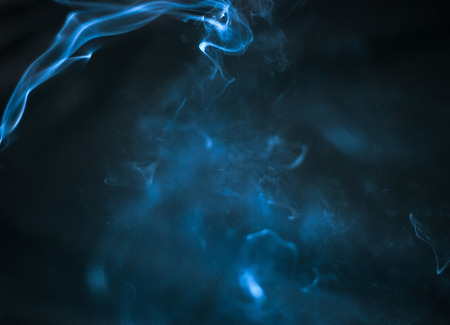 blue Smoke on black background , beautiful smoke,Fluffy Puffs of Smokeの写真素材