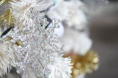 Merry christmas and happy new year Closeup of Christmas-tree  and gold balls,white balls, tree branches on abstract backgroundの写真素材