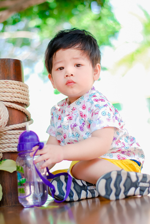 Cute little  Asian boy Happy smilling  in the park outdoors , Happy kidsの写真素材