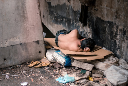 Homeless man sleeps on the street , Bangkok thailand.のeditorial素材