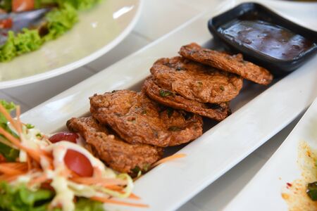 Fish Cake - paste balls serve with fresh vegetable on white dishの写真素材