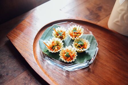 Thai food, Kratong Thong (Minced Chicken and Sweet Corn in Crispy Golden Cup) on dishの写真素材