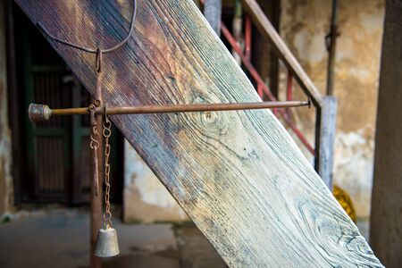 Bronze medieval scales , Ancient scales with the weight balance put on wooden background.