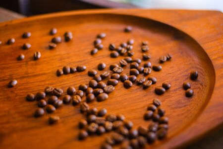 Coffee beans   on a wooden table with copy spaceの写真素材
