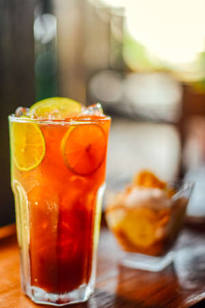 Iced Lemon tea in a glass on wood table,Fresh Homemadeの写真素材