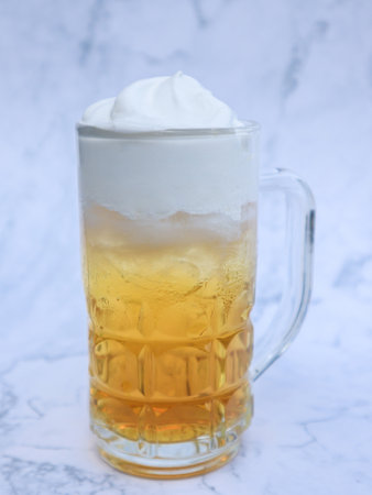 Butterscotch Butter Beer in a glass on white blackground, Sweet Homemade