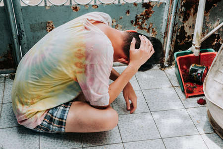 Homeless man sleeps on the street , Bangkok thailand.の写真素材