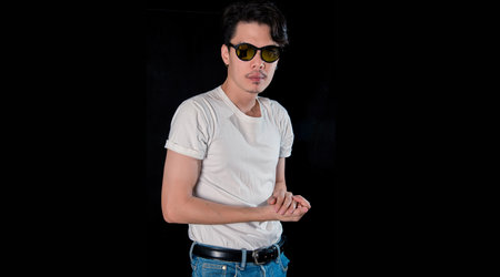 Portrait of men with sunglasses standing looking camera  on dark studio background , asianの写真素材