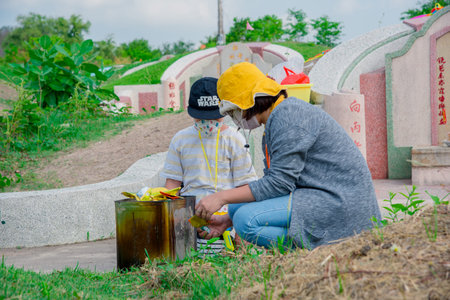 Chonburi, Thailand, 9, April, 2018: Chinese descendants cleaning tomb and offering prayers to...