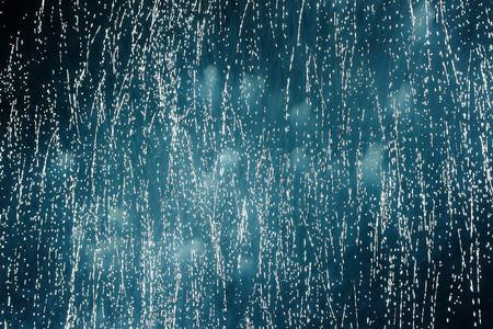 Sparkling rain of fireworks. Celebratory fireworks in the night sky as background.の写真素材