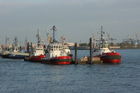 Resting tugboats are waiting for their work in the Hamburg harbor. Hamburg, Germany - October 25, 2009.のeditorial素材