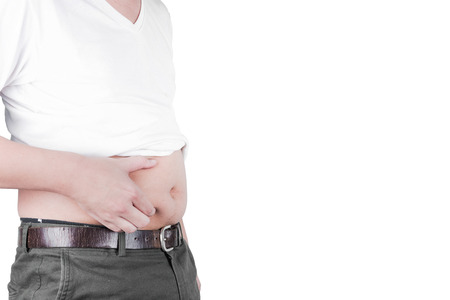 Obese Asian men use hands to grip the fat area. Obesity healthcare and health problem concept  isolated on white background, clipping pathの写真素材