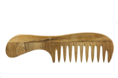 Light wooden comb isolated on white background