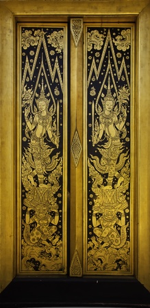 The golden door at the Thai temple architecture of temple is marvellous painted and decorated.の写真素材