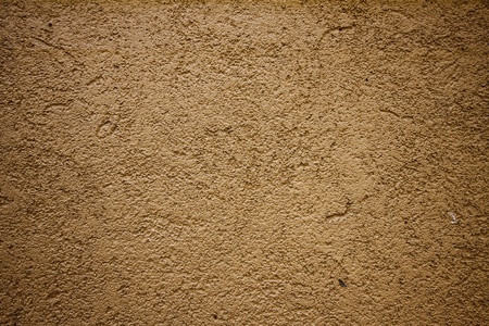The red cement wall as the texture background for design artwork.