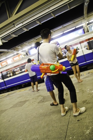 BANGKOK - APRIL 14  Thai people gathers together to join the water fighting in Songkran festival on April 14 2012 at Sliom road Bangkok Thailand のeditorial素材