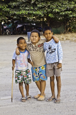 SARABURI - DECEMBER 10 : A groups of children play and smiles together on Decomber 10  2011 at the rural area in Saraburi Thailand.のeditorial素材