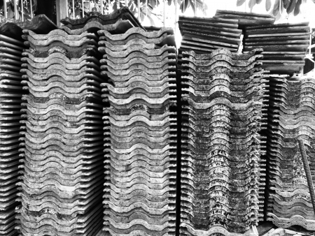 The scafffolders and bared concrete during the renovation at the construction site の写真素材