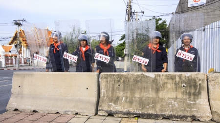 BANGKOK - NOVEMBER 11 : The police officers are on the duty at the bunker to confront the protestors...