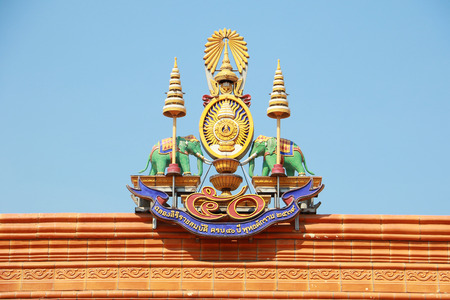 A traditional roof of chinese temple in Thailand decorated with royal emblem, royal seal of the King...