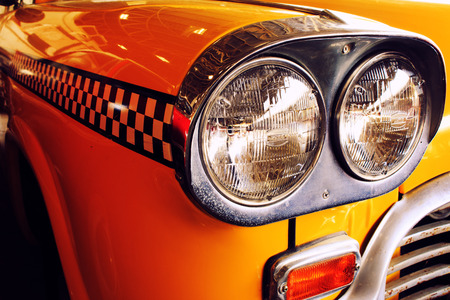 Yellow Cab Taxi, Color detail on the headlight of Taxi Checkerの写真素材