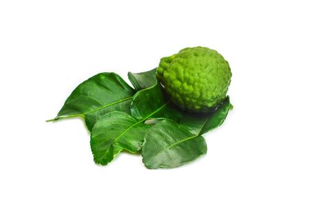 fresh bergamot and green leaves on white background