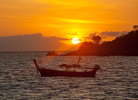 Sunset with boat in Andaman sea , South of Thailand.の写真素材