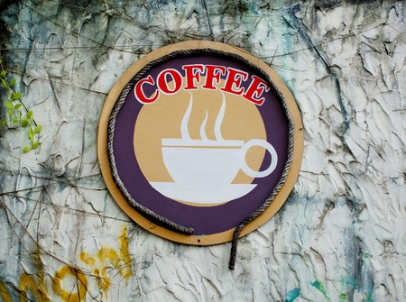 Grunge label coffee on old wallの写真素材