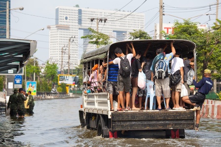 BANGKOK, THAILAND - NOVEMBER 5, 2011 : Rescue teams helping people to get home during the worst flooding in decades on November 5,2011 Bangkok, Thailand.のeditorial素材