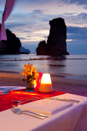 dinner on sunset at beach in Thailandの写真素材