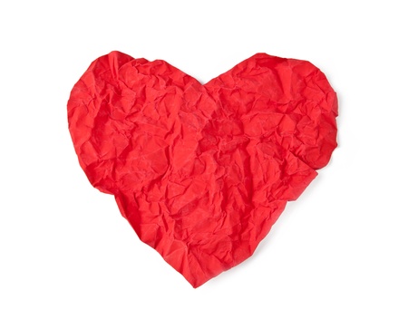 Red crumpled paper heart isolated on white backgroundの写真素材
