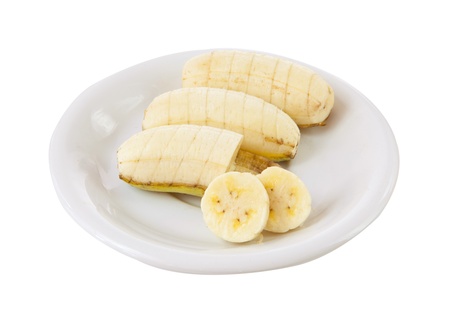 banana on dish isolated on white backgroundの写真素材