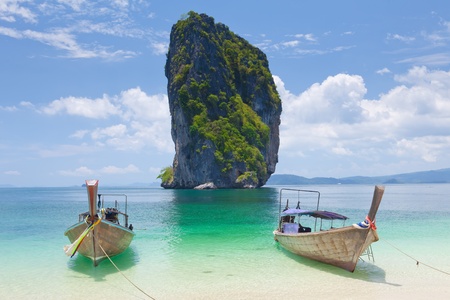 Cliff and boats and the clear sea Phi Phi Leh south of Thailandの写真素材