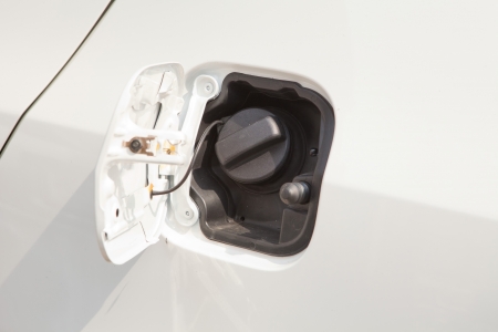 Closeup refuel gasoline on white carの写真素材