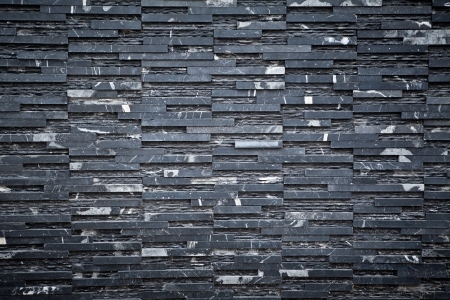 old black brick wall pattern as backgroundの写真素材