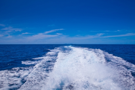 speed boat prop wash, white wake on the blue ocean seaの写真素材