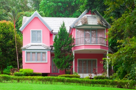 Beautiful pink house and big tree in forestのeditorial素材