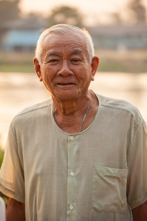 Portrait Of Happy Senior Asian Man At Outdoorの写真素材