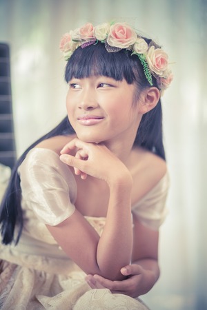 Portrait of a beautiful asian girl with flower crownの写真素材