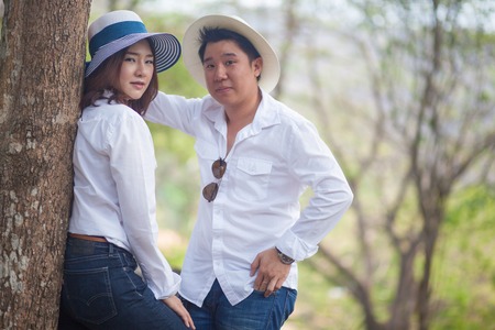 Happy young asian couple in love outdoorの写真素材