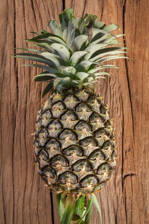 pineapple on the wood texture background