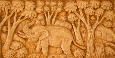Carved Thai elephant on the woodの写真素材